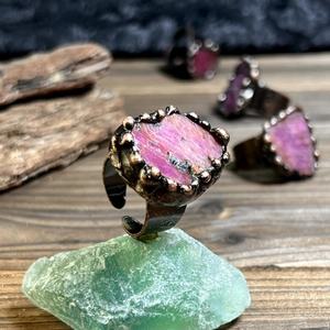 Vintage bronze plated adjustable ring featuring a natural raw pink gemstone centerpiece
