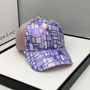 Detail of purple sequin checkerboard pattern and breathable pink mesh on the baseball cap