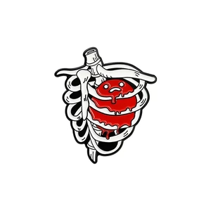 Macro shot of anatomical rib cage brooch with melting red heart for doctors and nurses
