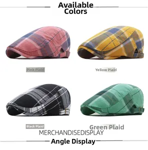 Detail view of colorful plaid newsboy caps in pink, yellow, black and green fabric