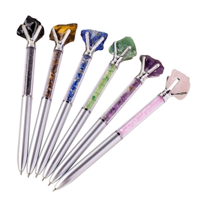 Silver metal ballpoint pens with natural raw crystal tops and colorful stone fillings