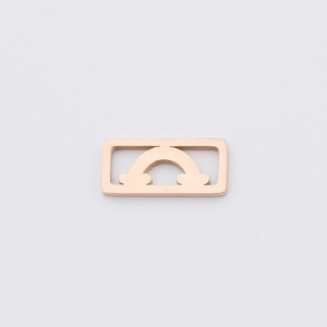 Detail of rose gold mirror-polished stainless steel charm with rainbow cloud cutout