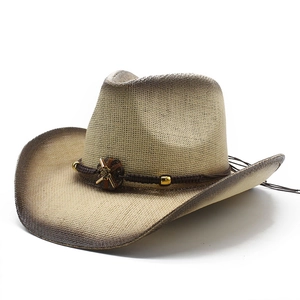 Detail of gradient woven straw cowboy hat featuring decorative beads and braided band