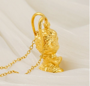 Detailed side view of golden Sun Wukong pendant with premium silk background texture