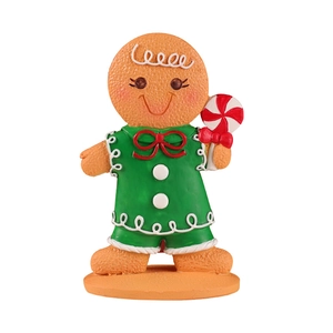 Christmas Gingerbread Man figurine in green dress holding candy cane on white background