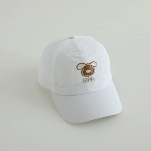 Detail of white kids baseball cap featuring a brown puppy patch and breathable mesh side