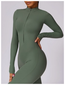 Detail of olive green yoga jumpsuit featuring high collar zipper and thumbhole cuffs