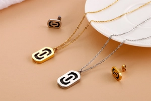 Detailed set of paperclip necklaces and stud earrings in gold and silver stainless steel