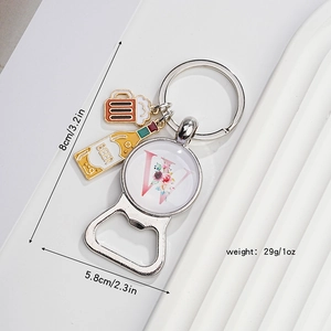 Detail view of beer bottle opener keychain with letter W charm and size measurements