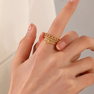Three-piece gold stainless steel ring set with star pendant and hollow crown design