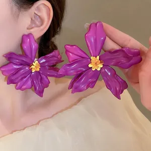 Chic purple acrylic flower stud earrings featuring a glossy five-petal floral design