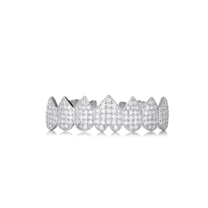 Macro shot of silver hip-hop grillz with heart and teardrop shapes set in white zircons