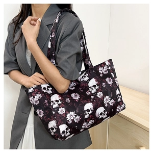 Detail showing high-density skull and floral print fabric on a large tote bag