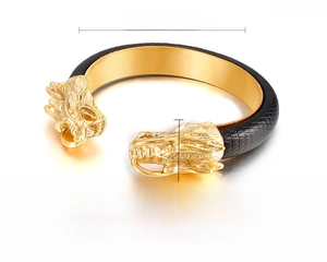 Detailed view of the 66mm golden dragon head bangle with black leather and size markings