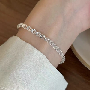Elegant silver twisted rope chain bracelet with a sparkling woven texture for women