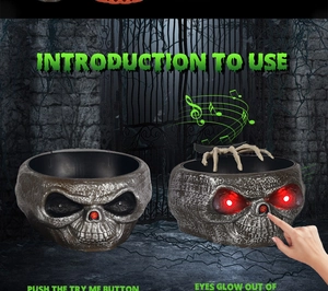 Interactive skull candy bowl with glowing red eyes and moving skeleton hand
