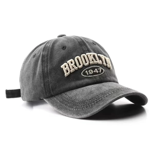 Vintage dark grey washed cotton baseball cap with Brooklyn 1947 embroidery in studio light