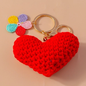 Handmade crochet keychain with red heart and colorful flower on gold metal ring