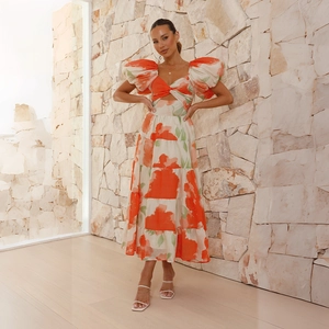 Close-up of floral puff sleeves and front twist hollow detail on the midi dress