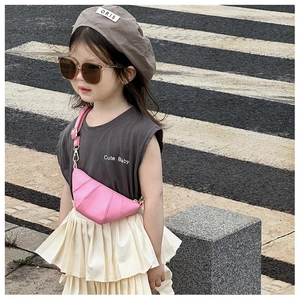 Pink crescent horn crossbody bag for kids styled with grey beret and fashion sunglasses