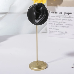 Creative black silicone ear earring display stand with a golden metal rod and base