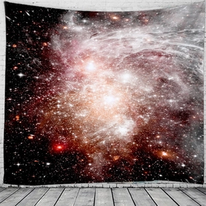 Detail of galaxy tapestry with vibrant nebula and stars hanging on a white brick wall