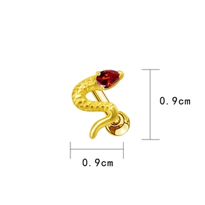 Macro shot of gold snake cartilage earring with red zircon eye and 0.9cm size scale