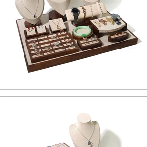 Detail of walnut wood and beige velvet jewelry display set for necklaces and rings