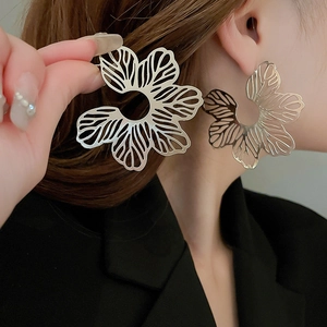 Minimalist silver flower hollow earrings with elegant oversized cutout metallic design