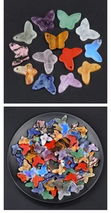 Macro detail of colorful butterfly-shaped natural stone pendants with pre-drilled holes