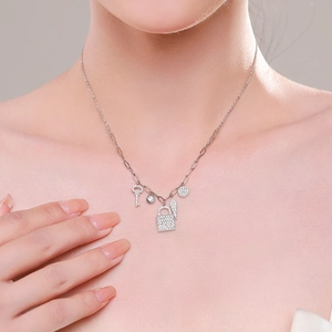 S925 Sterling Silver necklace featuring key and lock pendants on a stylish paperclip chain