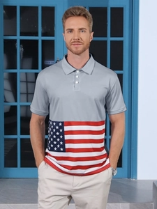 Detailed close-up of men's polo shirt featuring grey fabric and American flag print panels