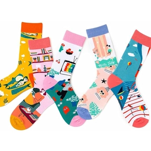 Flat lay of colorful cotton crew socks featuring diverse creative illustration patterns