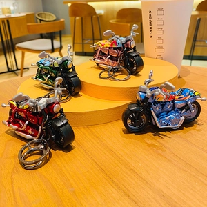 Cartoon alloy pullback motorcycle keychains in four colors with graffiti style detailing