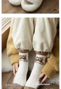 Close-up of thick bear pattern coral fleece socks with ribbed cuffs for winter warmth