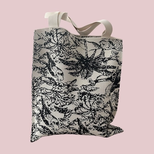 Close-up of black and white Toile de Jouy floral pattern on durable canvas tote bag
