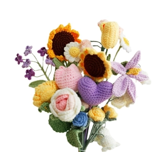 Handmade crochet sunflower and rose yarn bouquet with mixed floral arrangement on white background