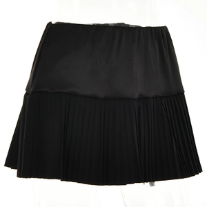 Detailed view of the black pleated stitching and fabric texture on this stylish mini skirt