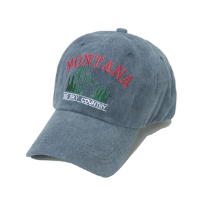 Vintage washed blue baseball cap featuring Montana mountain landscape embroidery
