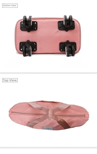 Pink travel bag detail showing 360-degree swivel wheels and dual top handles design