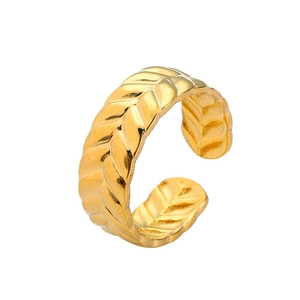 Macro view of gold plated open ring featuring elegant hollow geometric texture design