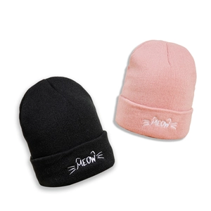 Cute MEOW cat ear knitted beanies in black and pink with soft ribbed warm fabric