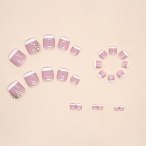 Pink French pedicure press-on nails set with sparkling rhinestones and metal beads
