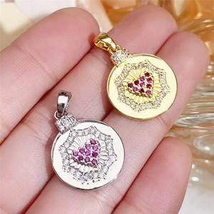 Macro shot of gold and silver heart pendants featuring purple stones and white zircon