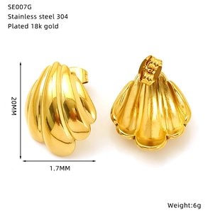 Detail view of 18k gold plated scallop shell stud earrings with 20mm height dimensions