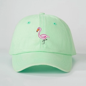 Detail of mint green baseball cap featuring delicate pink flamingo embroidery on the front