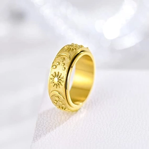 Rotating stainless steel gold ring with sun moon star patterns for anxiety relief