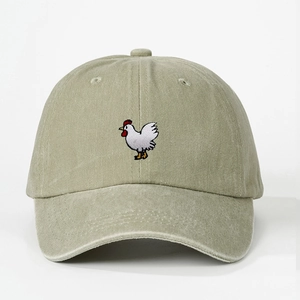Close-up of cute white chicken embroidery on washed vintage cotton baseball cap
