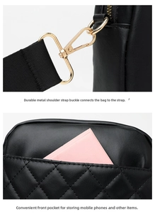 Detail of black quilted shoulder bag featuring gold metal buckles and a functional front pocket