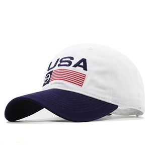 White USA baseball cap with navy brim and embroidery from a 45-degree angle
